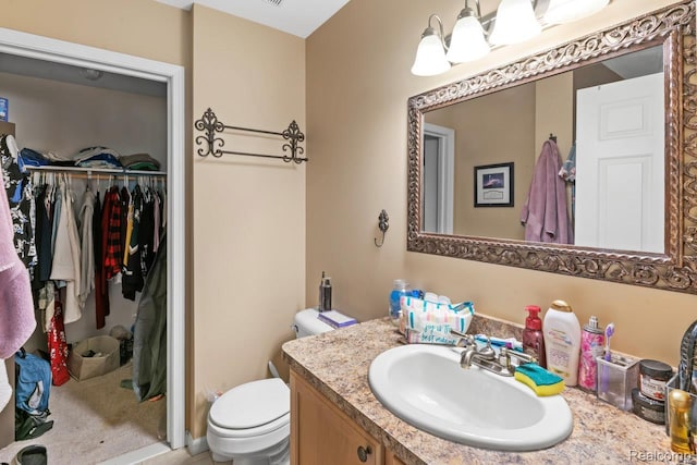 2255 Crystal Crossing Dr, Howell, MI 48843 - bathroom featuring vanity and a spacious closet