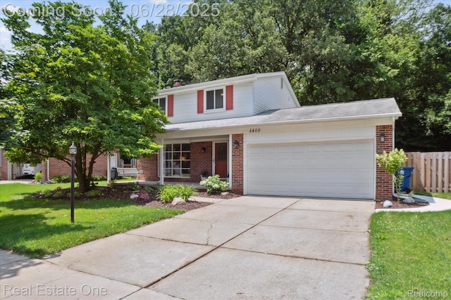 8409 Sandpiper St, Canton, MI 48187 - traditional-style house featuring brick siding, a garage, concrete driveway, and a chimney