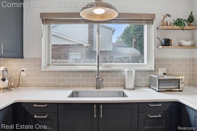 8409 Sandpiper St, Canton, MI 48187 - kitchen with tasteful backsplash, light countertops, and open shelves