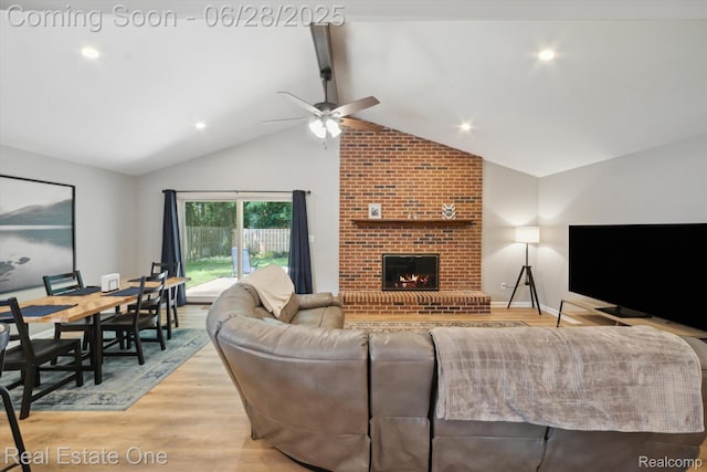 8409 Sandpiper St, Canton, MI 48187 - living area featuring a ceiling fan, a fireplace, and light wood-style flooring