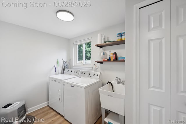 8409 Sandpiper St, Canton, MI 48187 - washroom featuring separate washer and dryer and light wood finished floors