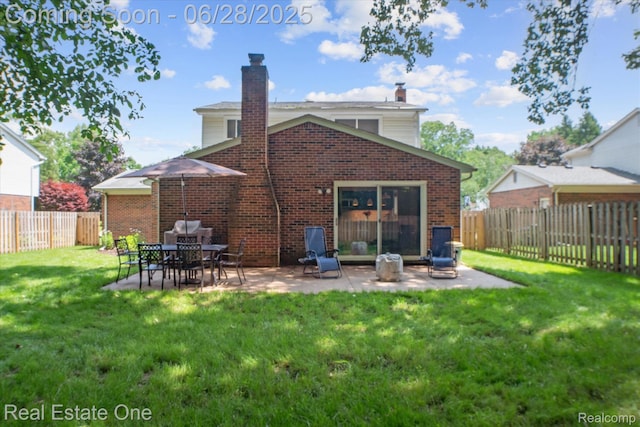 8409 Sandpiper St, Canton, MI 48187 - rear view of property with a chimney, a fenced backyard, a patio area, and brick siding