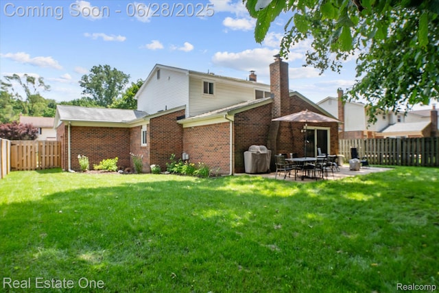 8409 Sandpiper St, Canton, MI 48187 - back of property featuring brick siding, a fenced backyard, and a patio area