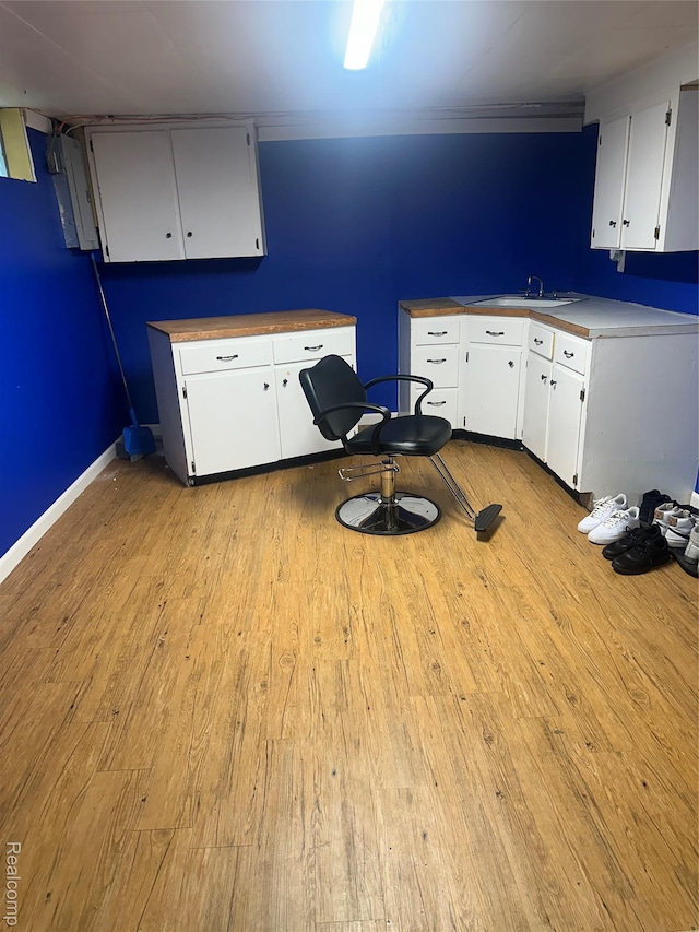 967 Hubbard Ave, Flint, MI 48503 - kitchen featuring light wood-style floors and white cabinets