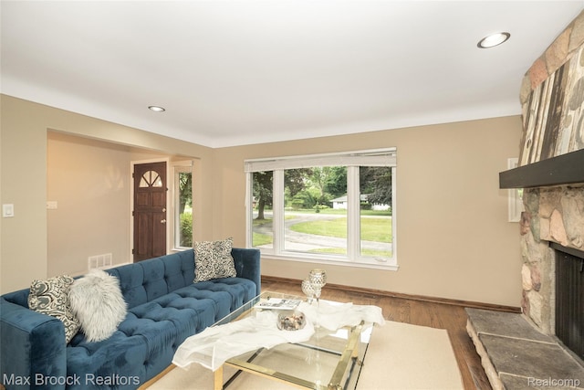 6730 Halyard Rd, Bloomfield Hills, MI 48301 - living area featuring a stone fireplace, wood finished floors, and recessed lighting