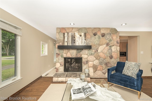 6730 Halyard Rd, Bloomfield Hills, MI 48301 - living room with a stone fireplace, recessed lighting, and wood finished floors