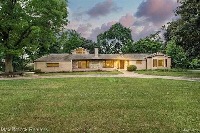 6730 Halyard Rd, Bloomfield Hills, MI 48301 - view of front facade with a chimney, a front lawn, and driveway