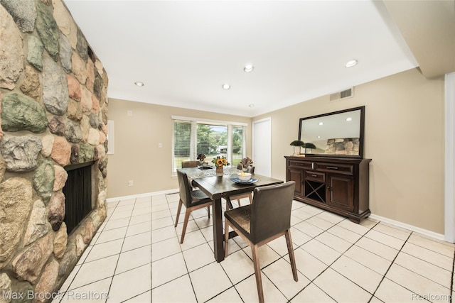 6730 Halyard Rd, Bloomfield Hills, MI 48301 - dining space with light tile patterned floors, a fireplace, and recessed lighting