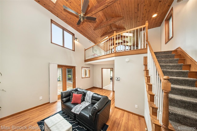 6730 Halyard Rd, Bloomfield Hills, MI 48301 - living room featuring wooden ceiling, ceiling fan, stairway, light wood-type flooring, and high vaulted ceiling