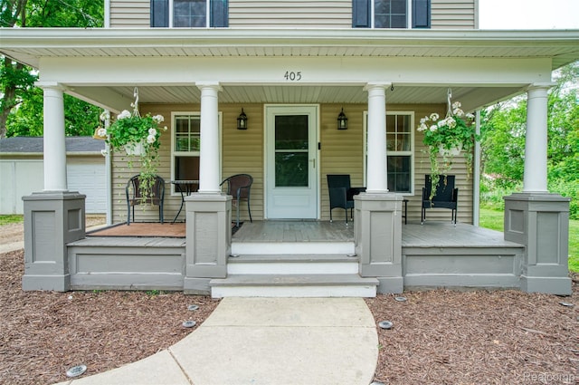 405 Garden Ln, Fowlerville, MI 48836 - property entrance with a porch