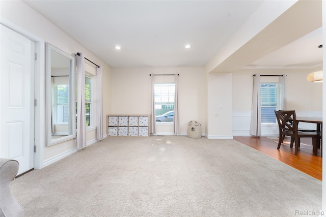 405 Garden Ln, Fowlerville, MI 48836 - unfurnished living room with carpet flooring and recessed lighting