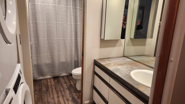 3400 Lakeside Dr S Unit 17, Petoskey, MI 49770 - bathroom featuring wood finished floors, vanity, washer / dryer, and curtained shower