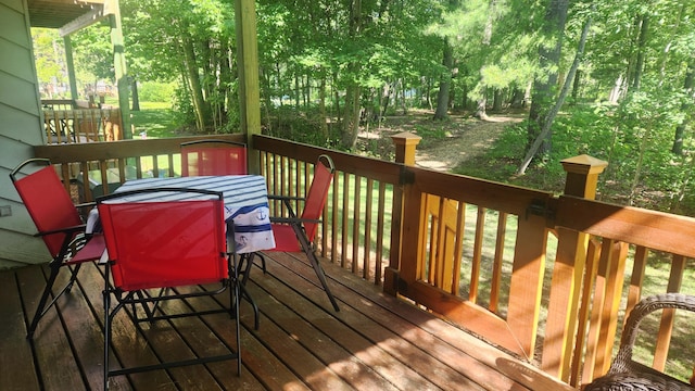 3400 Lakeside Dr S Unit 17, Petoskey, MI 49770 - deck featuring outdoor dining area