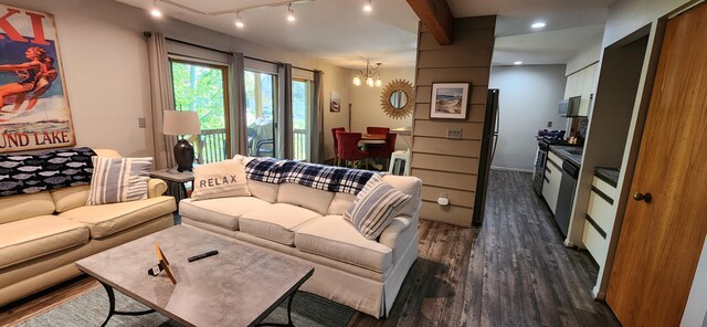 3400 Lakeside Dr S Unit 17, Petoskey, MI 49770 - living room featuring dark wood finished floors, a chandelier, rail lighting, and recessed lighting
