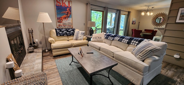 3400 Lakeside Dr S Unit 17, Petoskey, MI 49770 - living area featuring a chandelier and light wood finished floors