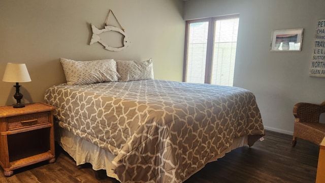 3400 Lakeside Dr S Unit 17, Petoskey, MI 49770 - bedroom with dark wood-style flooring and baseboards
