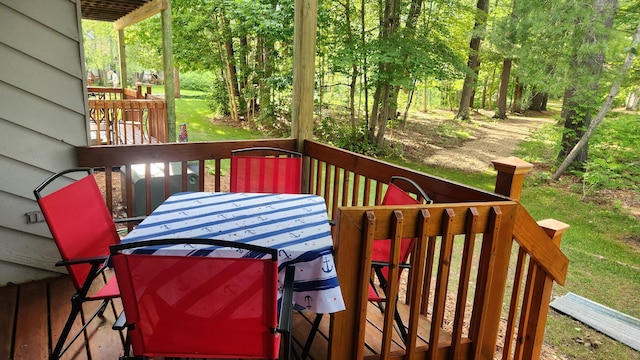 3400 Lakeside Dr S Unit 17, Petoskey, MI 49770 - wooden terrace featuring outdoor dining area