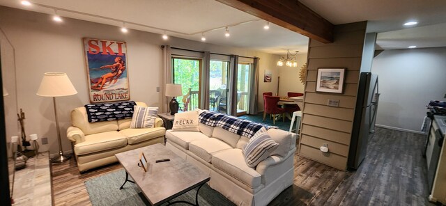 3400 Lakeside Dr S Unit 17, Petoskey, MI 49770 - living room with dark wood-style flooring, a chandelier, track lighting, and beamed ceiling