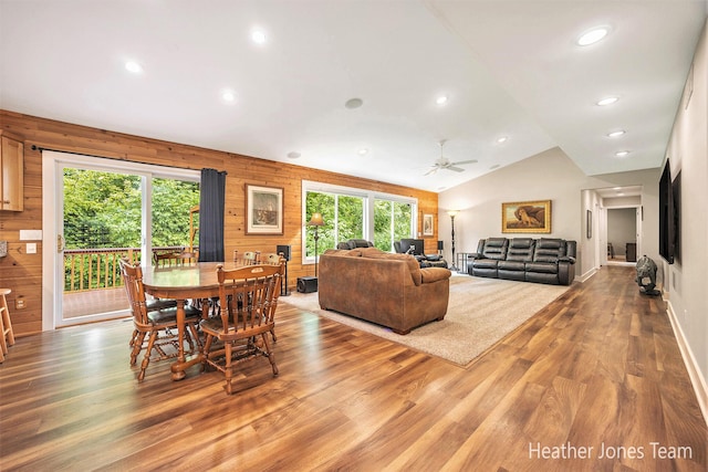 8035 Jericho Ave NE, Rockford, MI 49341 - dining area with wood finished floors, recessed lighting, lofted ceiling, a ceiling fan, and wooden walls