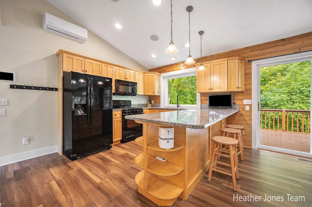 8035 Jericho Ave NE, Rockford, MI 49341 - kitchen with black appliances, an AC wall unit, dark wood finished floors, lofted ceiling, and a peninsula