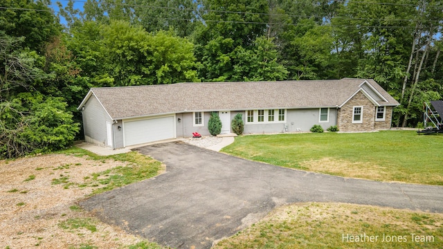 8035 Jericho Ave NE, Rockford, MI 49341 - ranch-style house featuring asphalt driveway, an attached garage, a front yard, roof with shingles, and stone siding