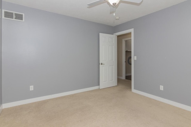 6107 Equestrian Woods Ct, Kalamazoo, MI 49009 - unfurnished room featuring light colored carpet, a ceiling fan, and a smoke detector