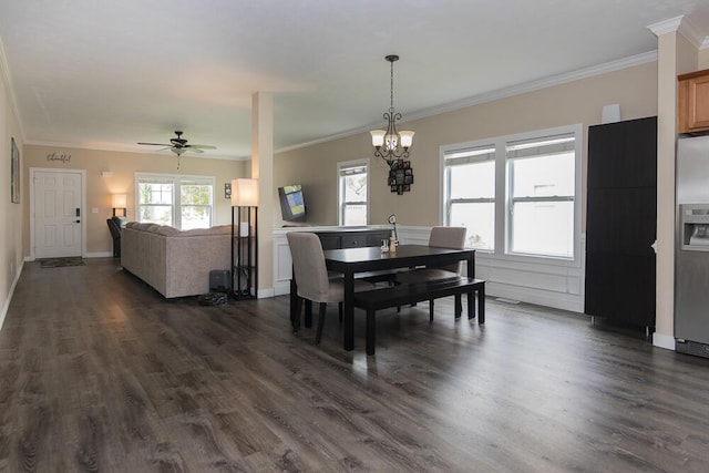 6107 Equestrian Woods Ct, Kalamazoo, MI 49009 - dining room with crown molding, dark wood-type flooring, a chandelier, and ceiling fan