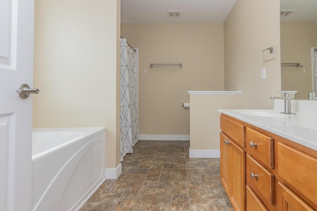 6107 Equestrian Woods Ct, Kalamazoo, MI 49009 - full bathroom with vanity, stone finish floors, a bath, and a shower with shower curtain