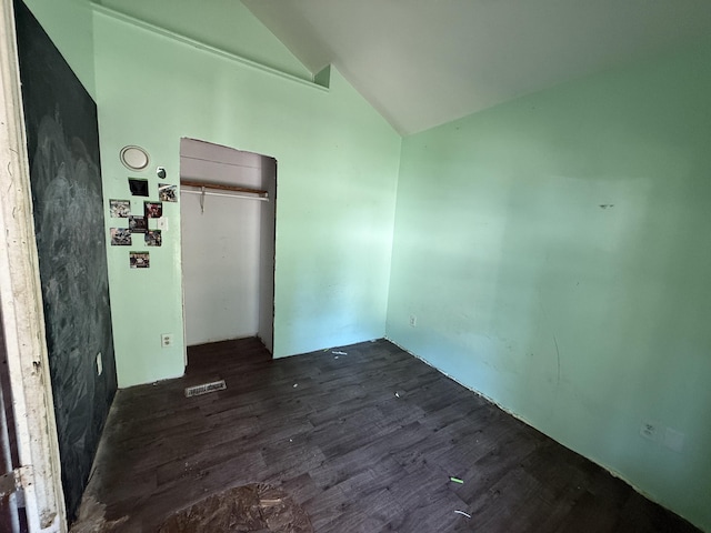 223 Washington Ave, Lakeview, MI 48850 - unfurnished bedroom featuring lofted ceiling and dark wood finished floors
