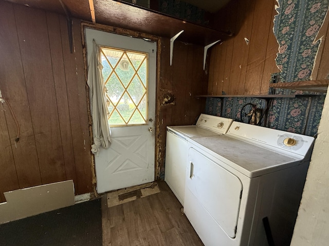 223 Washington Ave, Lakeview, MI 48850 - laundry area featuring washer and clothes dryer, wood finished floors, and wood walls