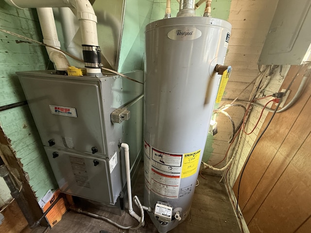 223 Washington Ave, Lakeview, MI 48850 - utilities with water heater, electric panel, and heating unit