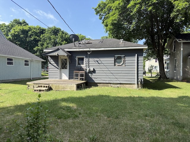 223 Washington Ave, Lakeview, MI 48850 - rear view of property featuring a lawn