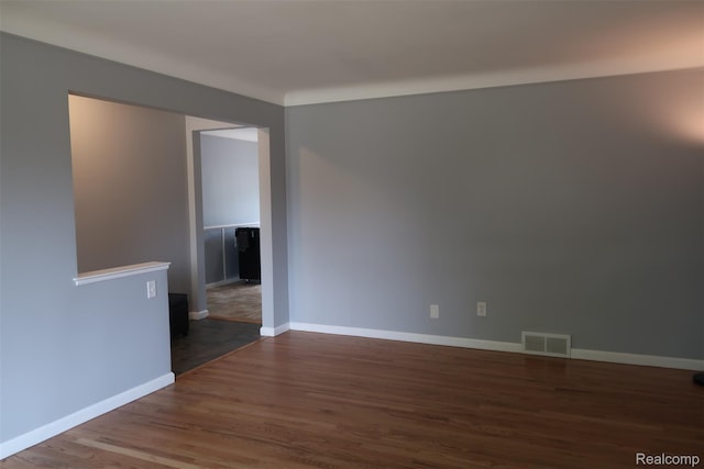 28242 Aline Dr, Warren, MI 48093 - unfurnished room featuring wood finished floors and baseboards