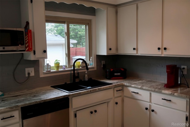 28242 Aline Dr, Warren, MI 48093 - kitchen featuring stainless steel appliances, backsplash, and white cabinets