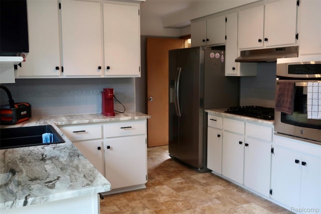 28242 Aline Dr, Warren, MI 48093 - kitchen featuring stainless steel appliances, under cabinet range hood, tasteful backsplash, and white cabinets