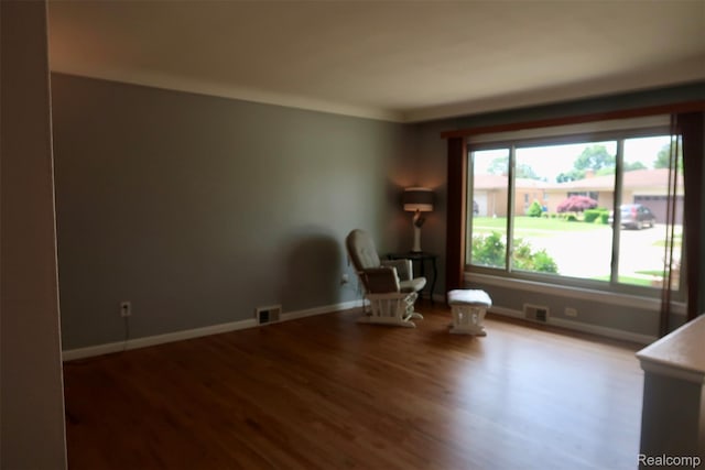 28242 Aline Dr, Warren, MI 48093 - living area featuring wood finished floors and baseboards