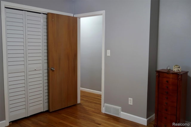28242 Aline Dr, Warren, MI 48093 - unfurnished bedroom featuring baseboards and wood finished floors