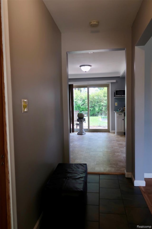 28242 Aline Dr, Warren, MI 48093 - corridor featuring tile patterned floors and baseboards