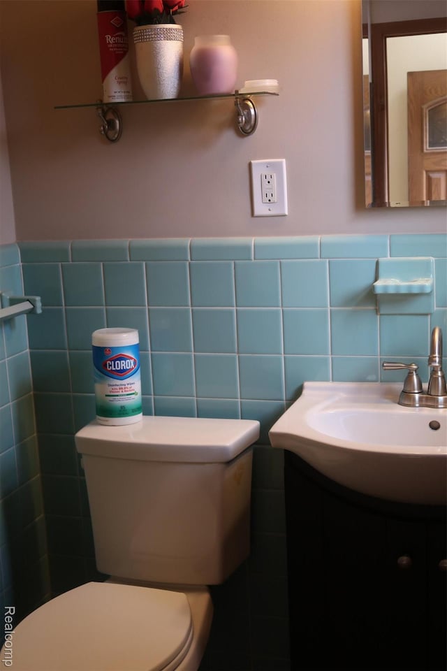 28242 Aline Dr, Warren, MI 48093 - half bathroom featuring tile walls, vanity, and wainscoting