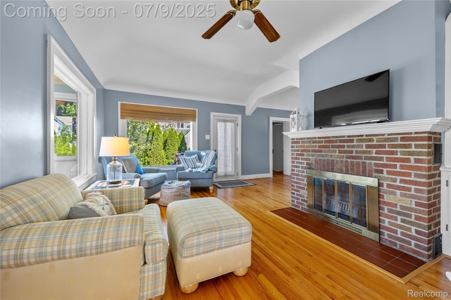 108 Highland Ave, Lake Orion, MI 48362 - living area featuring a ceiling fan, a fireplace, and wood finished floors