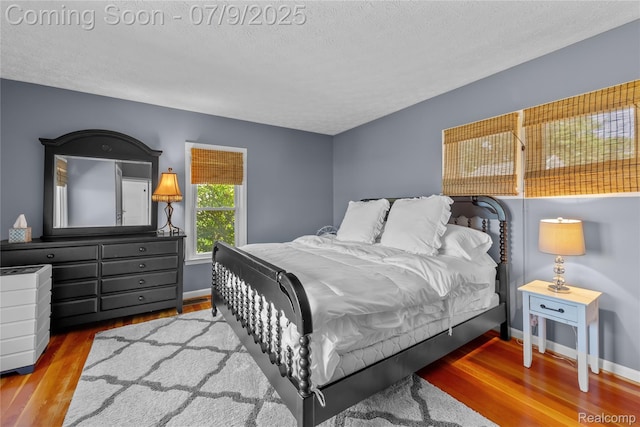 108 Highland Ave, Lake Orion, MI 48362 - bedroom with wood finished floors and a textured ceiling