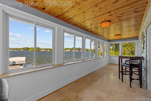 108 Highland Ave, Lake Orion, MI 48362 - sunroom / solarium with wood ceiling, stone finish floors, and a water view