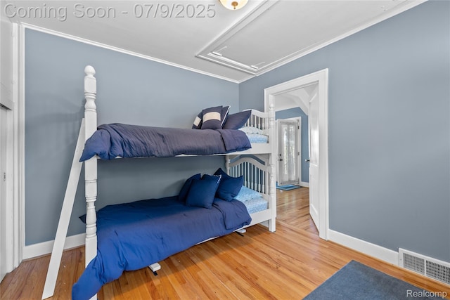 108 Highland Ave, Lake Orion, MI 48362 - bedroom featuring attic access, wood finished floors, and ornamental molding
