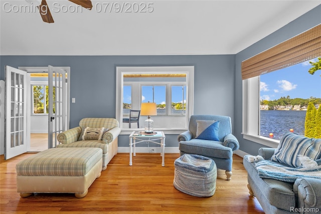 108 Highland Ave, Lake Orion, MI 48362 - living area featuring healthy amount of natural light, wood finished floors, a ceiling fan, and french doors