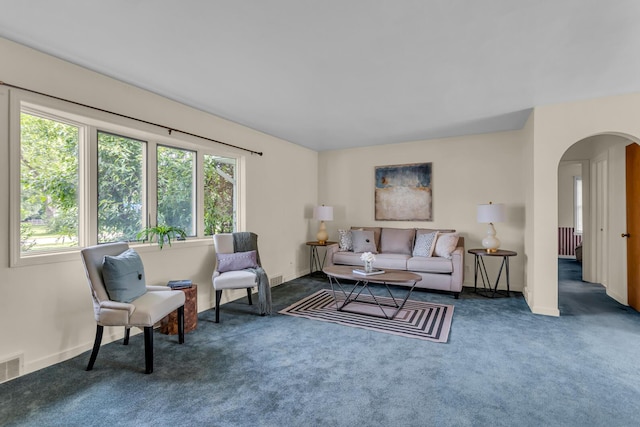 5951 Riverside Dr, Jackson, MI 49201 - carpeted living room featuring arched walkways and baseboards