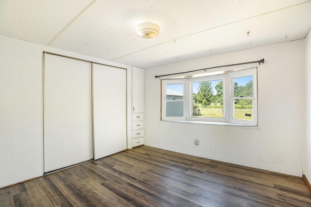 10295 S Osborn Ave, Fremont, MI 49412 - unfurnished bedroom featuring dark wood finished floors and a closet