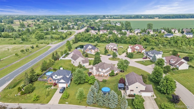 7759 W Branch Ct, Ypsilanti, MI 48197 - aerial view of property and surrounding area with nearby suburban area and a tree filled landscape