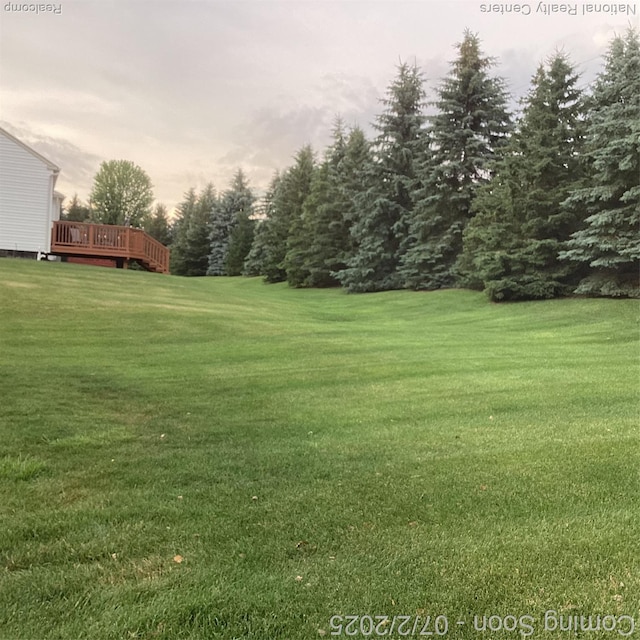 636 Zion Ct S, Howell, MI 48843 - view of grassy yard with a deck