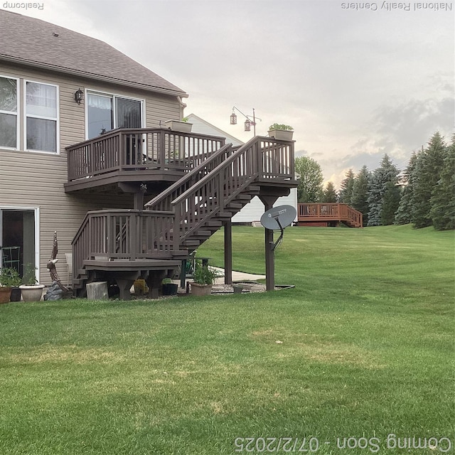 636 Zion Ct S, Howell, MI 48843 - view of grassy yard featuring a deck and stairway