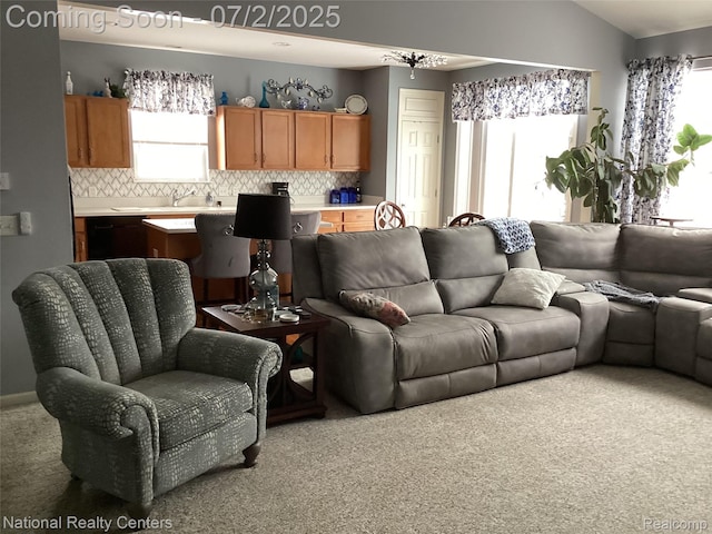 636 Zion Ct S, Howell, MI 48843 - living room featuring carpet, healthy amount of natural light, and vaulted ceiling